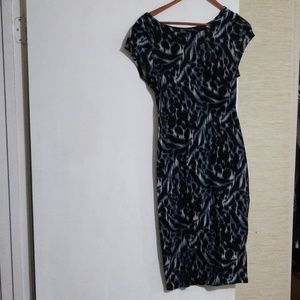 Form fitting dress that falls just below your knee